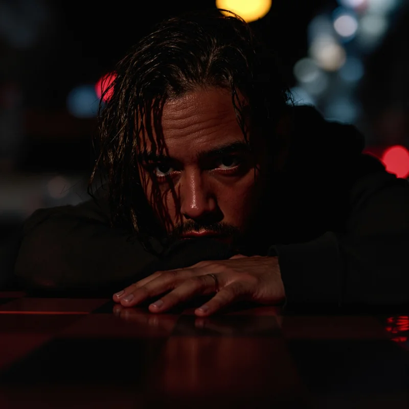 tuff PFP avatar with focused look and dark red accents